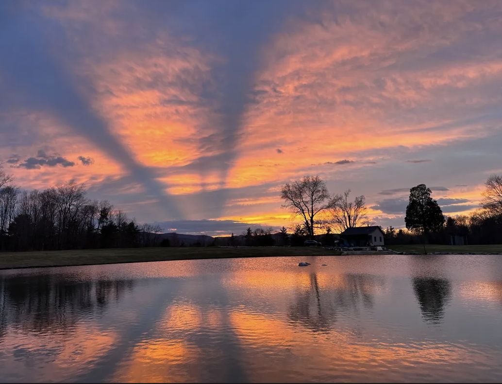 Sunset reflected in the pond beside the cabin